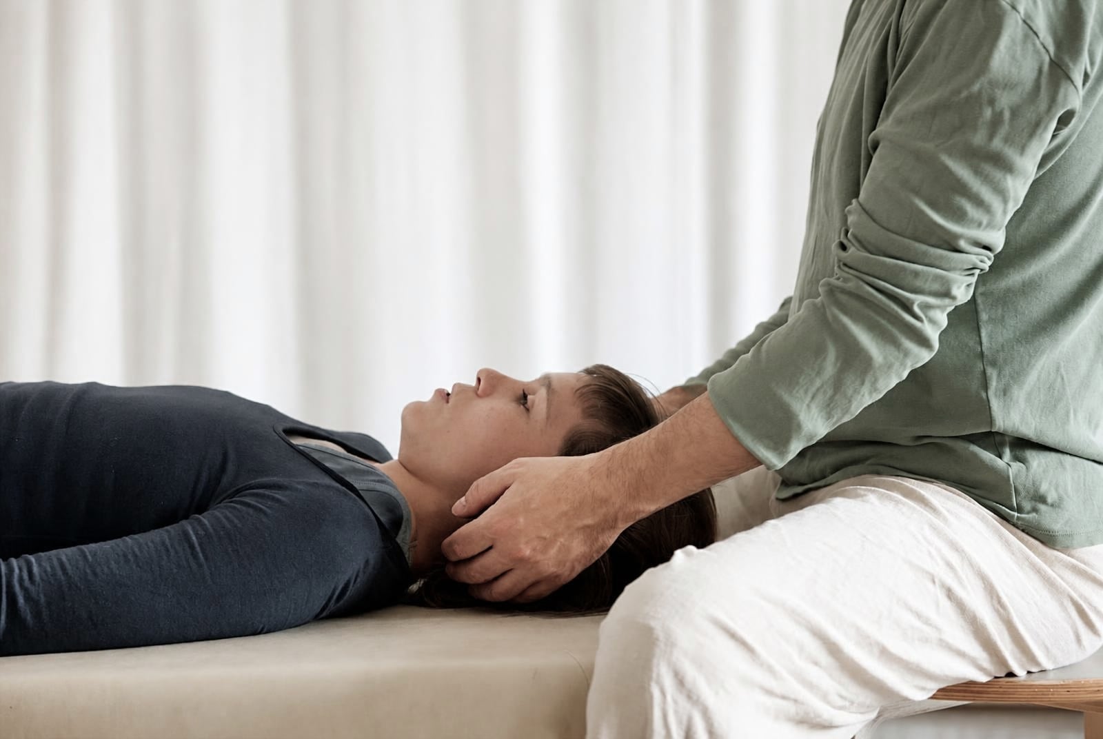 A one-to-one Feldenkrais session on a treatment table
